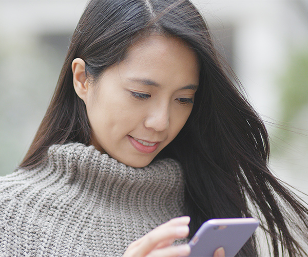Woman looking at cell phone